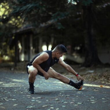 Man is stretching his leg